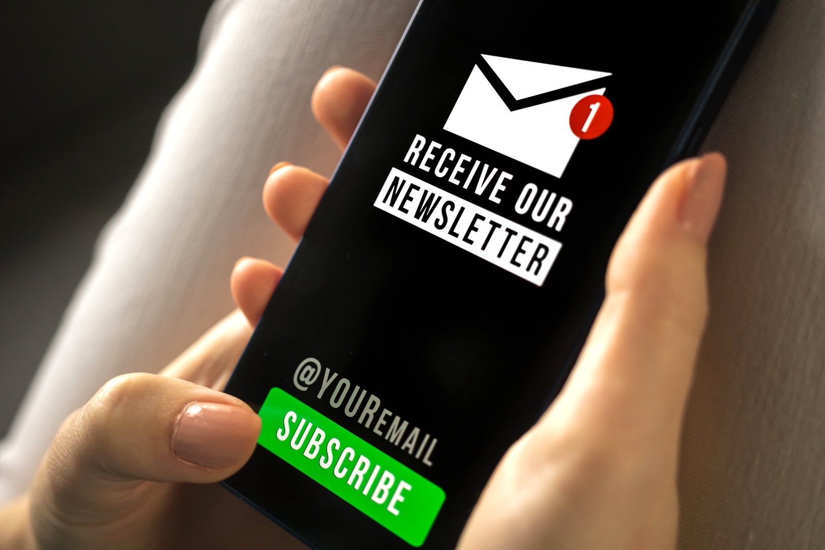 Woman holding mobile phone with newsletter signup page close-up. Register a new member concept photo closeup. Subscribe button