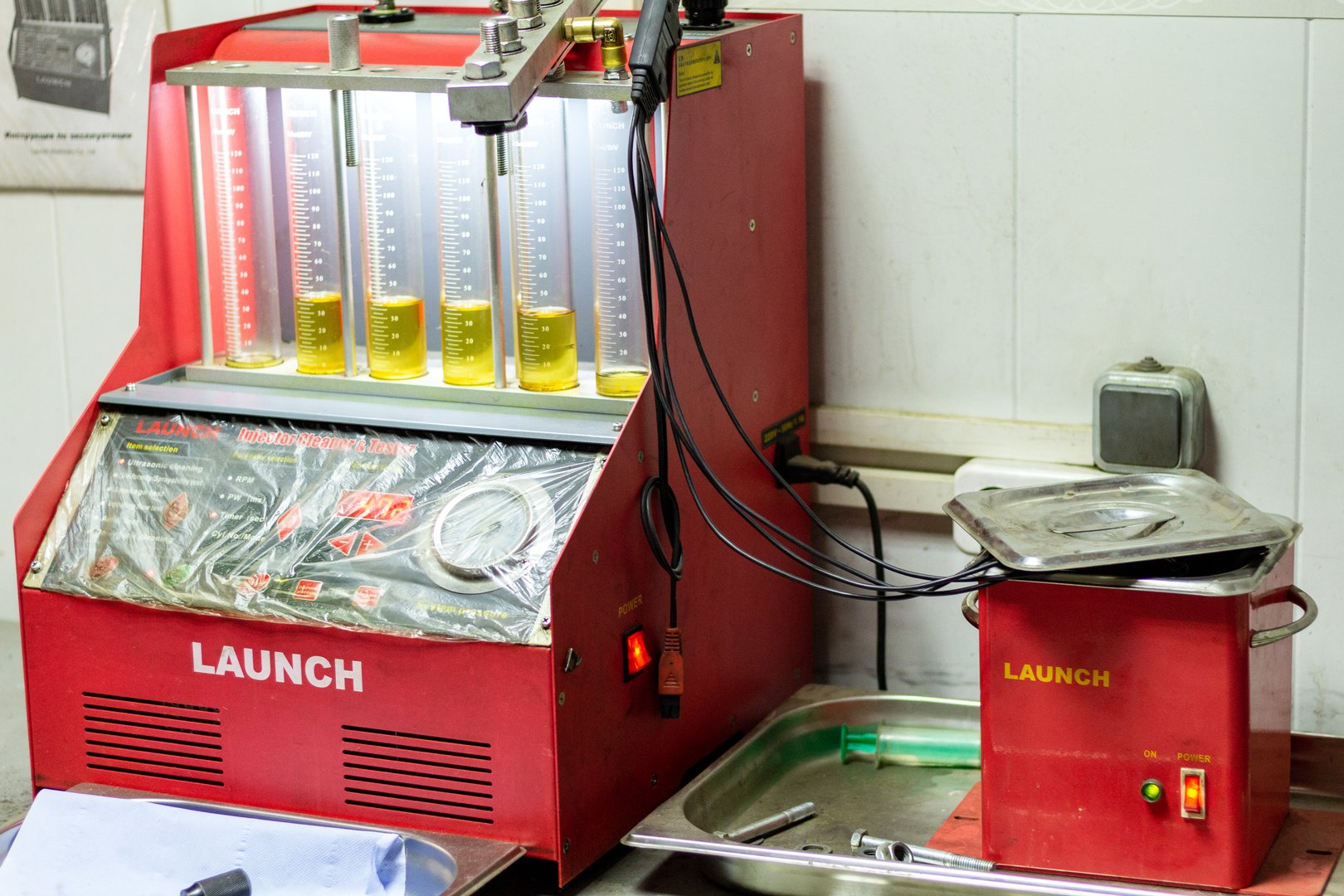 injector cleaner device repair service car auto engine close up selective focus