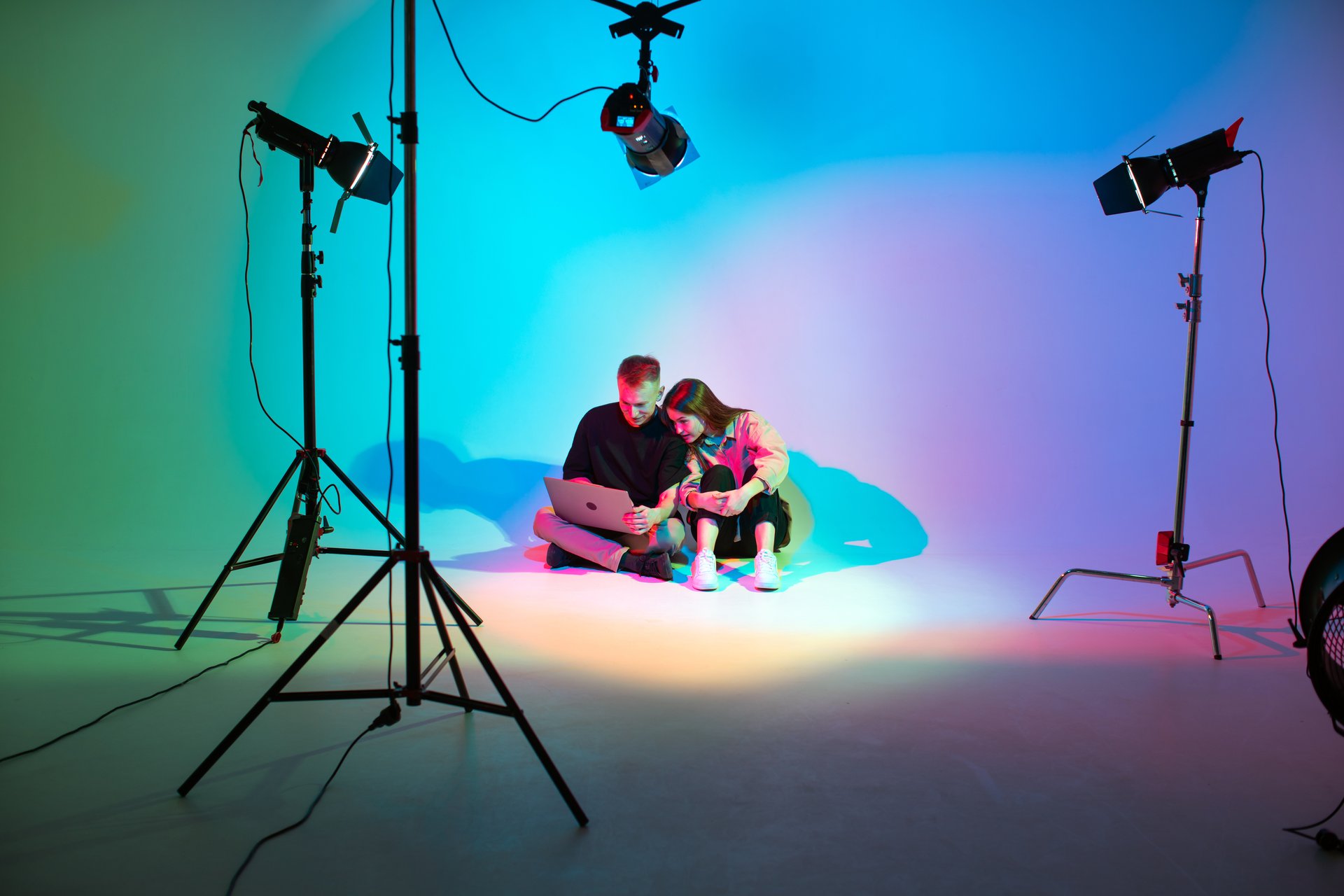 Creative team young girl and boy with laptop working