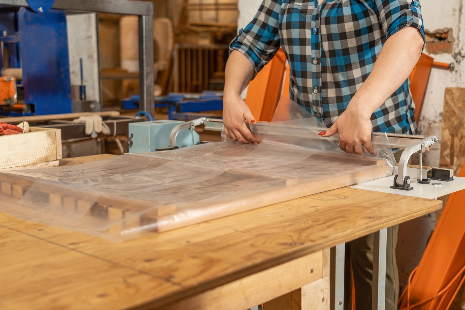 Skilled hands work hard to pack the product in the production area.