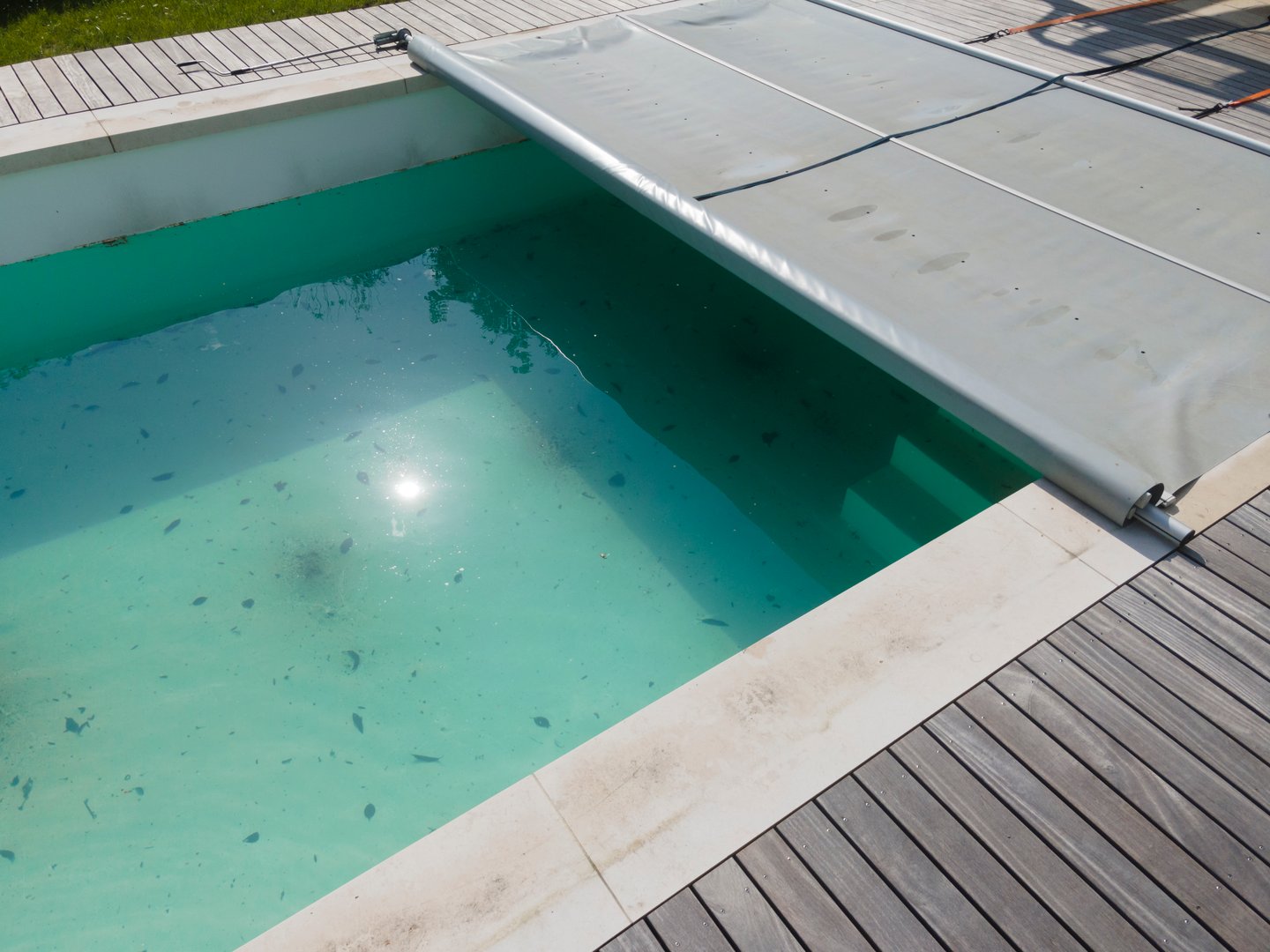 aerial drone photo of pool after winter, cleaning the plane, the pool, draining the dirty water, dirty pool before the spring