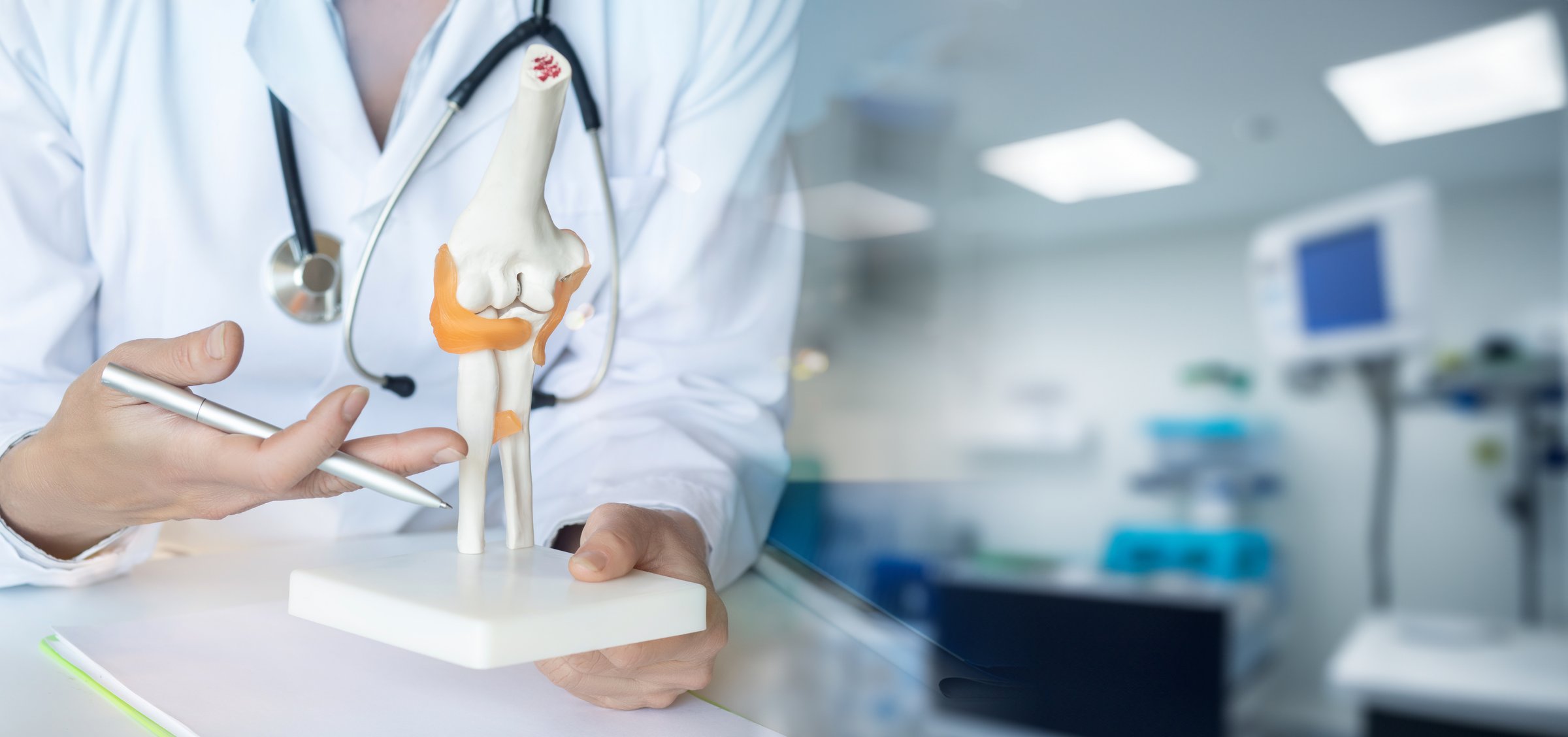 The doctor provides professional medical consultation and education to patients about joint health.