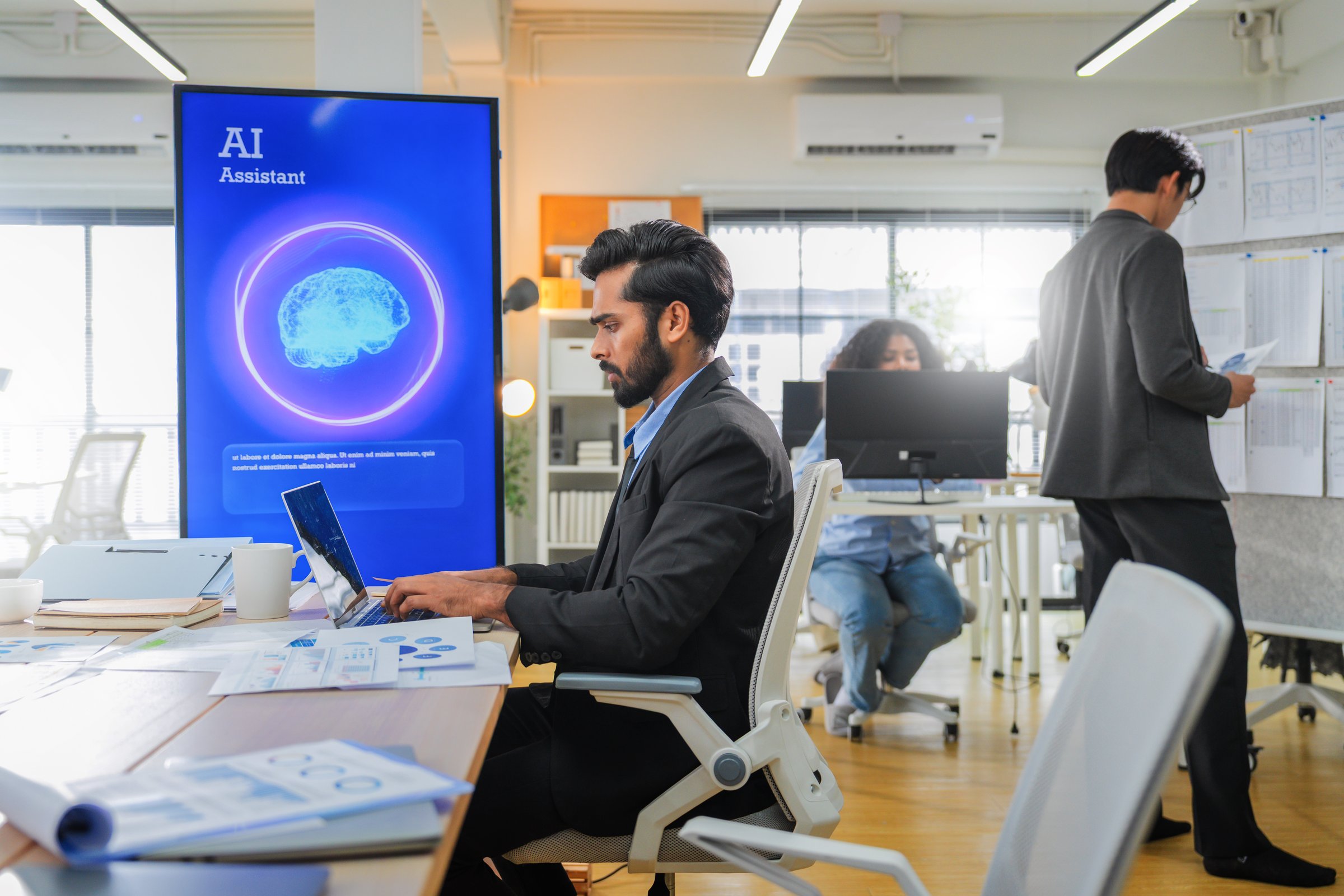 Business professional concentrates in coworking space leveraging AI powered virtual assistant and realtime big data analytics on laptop display for hyper automated workflow intelligence optimization