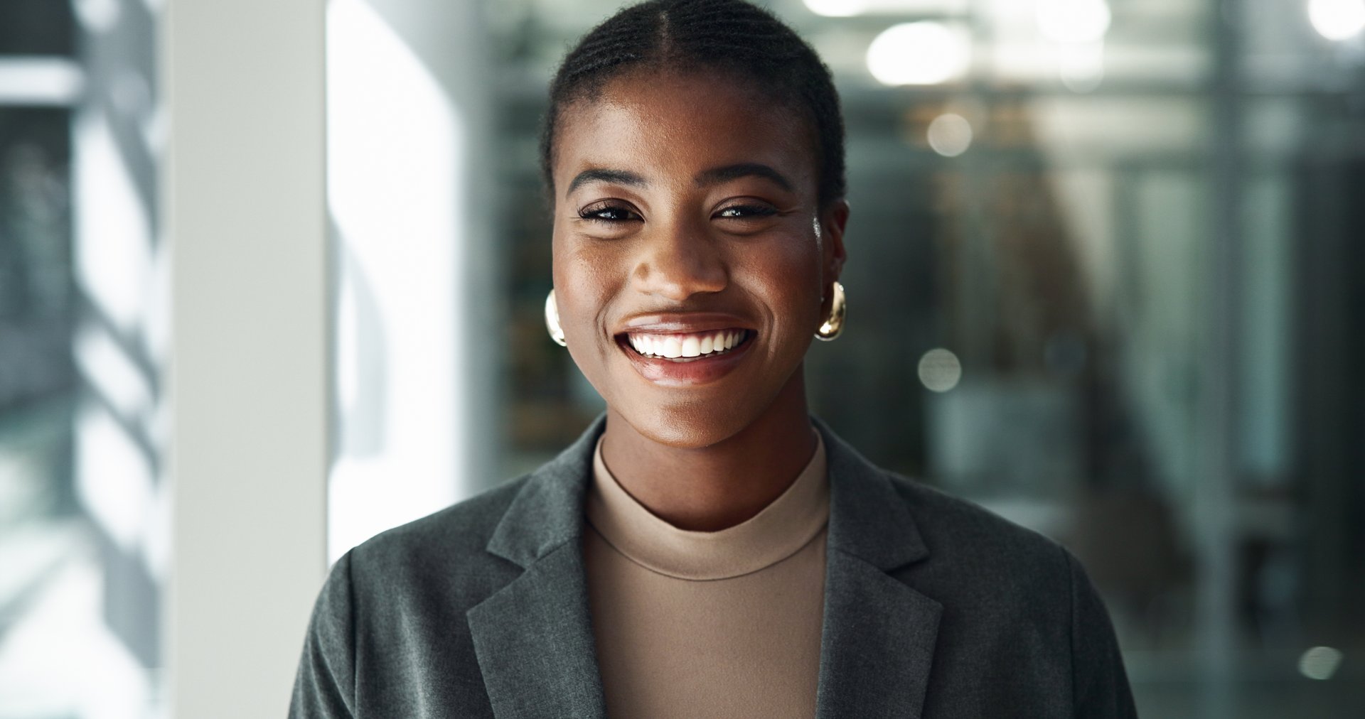 Portrait, pride and lawyer with business black woman in office for advocate, confidence and attorney clerk. Professional, legal counsel and smile with employee in law firm  for career