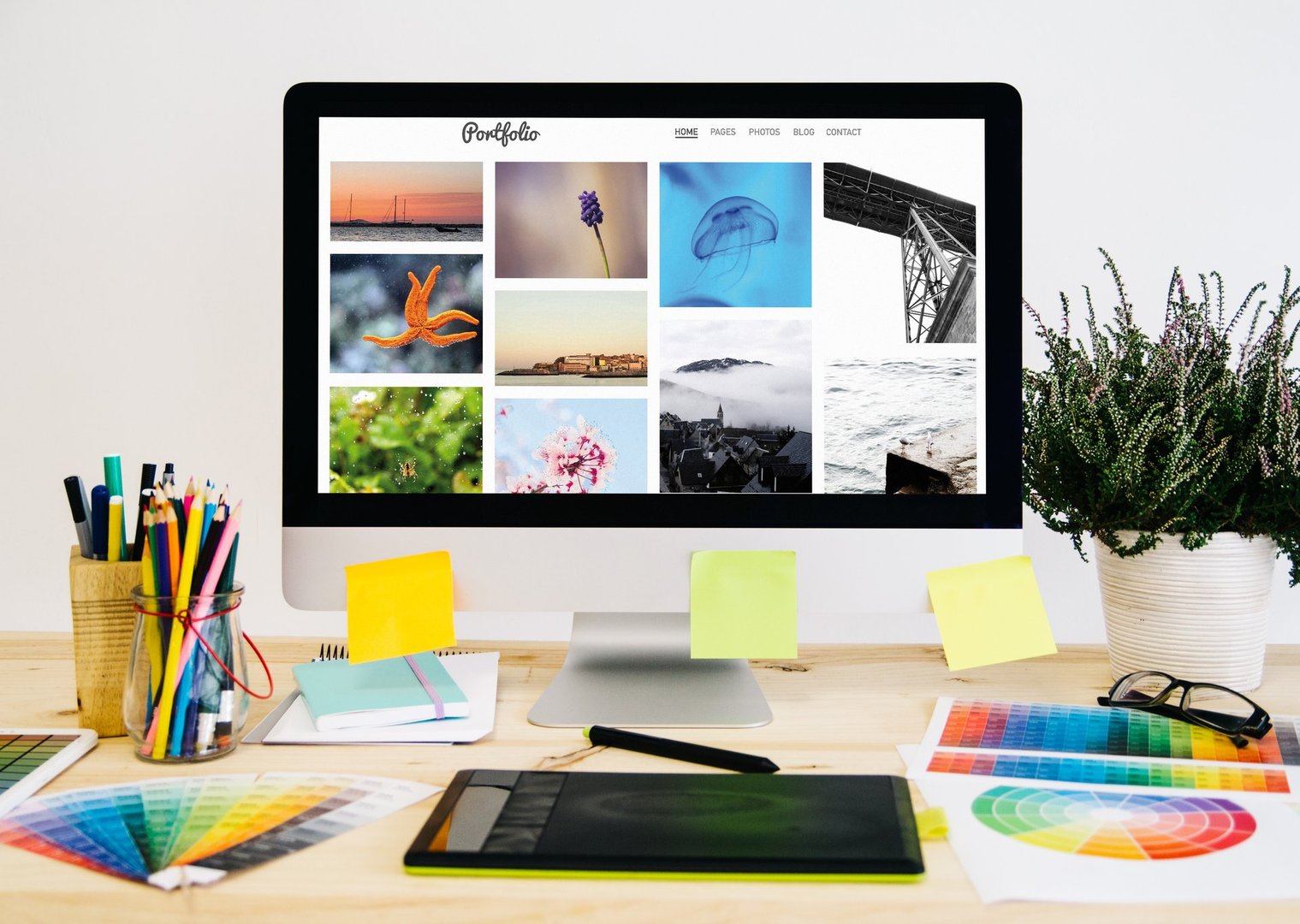Stationery desktop with design stuff, computer and graphic tablet. photo porfolio.