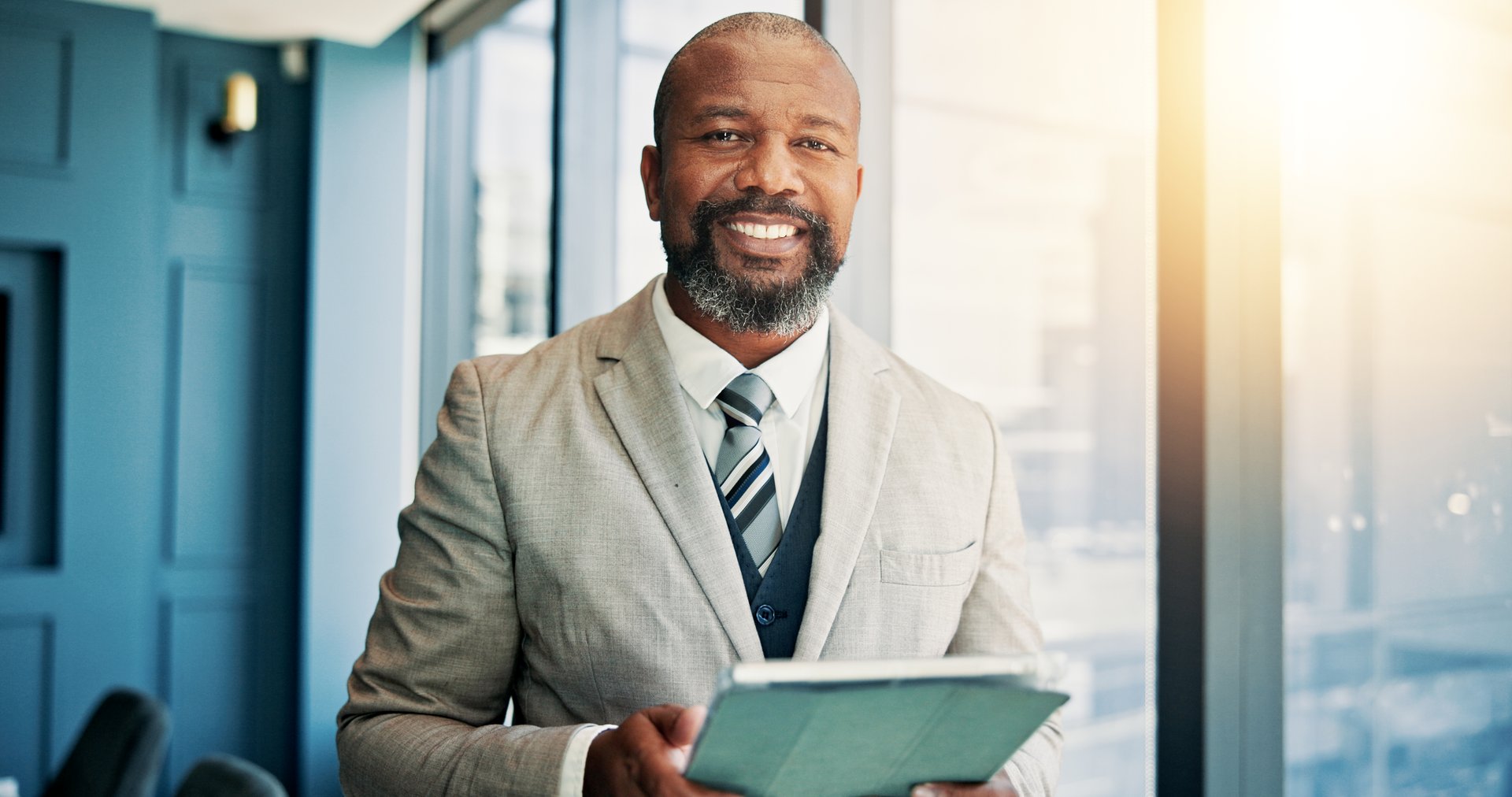African man, tablet and lawyer in office, smile and portrait with contact for legal consultation. Mature person, attorney and happy with touchscreen with app, lead and review at law firm