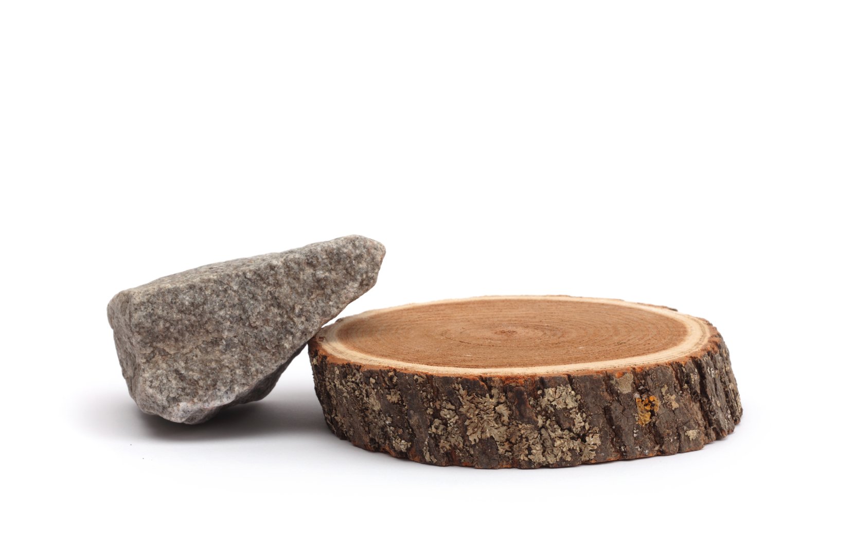 Wood circle stump, stones platform podium on white background. Minimal empty display product presentation scene.