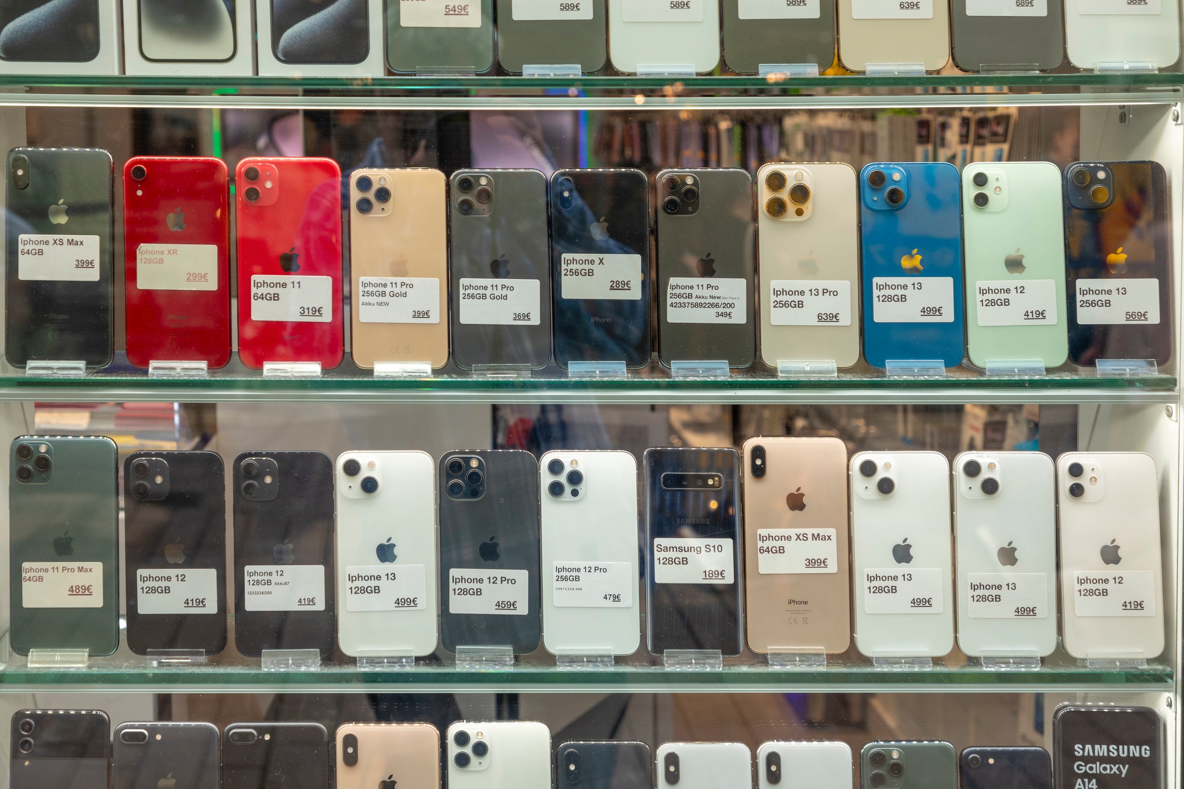 Wiesbaden, Germany - May 25, 2024: used mobile phones adn handys in the shop window for sale.