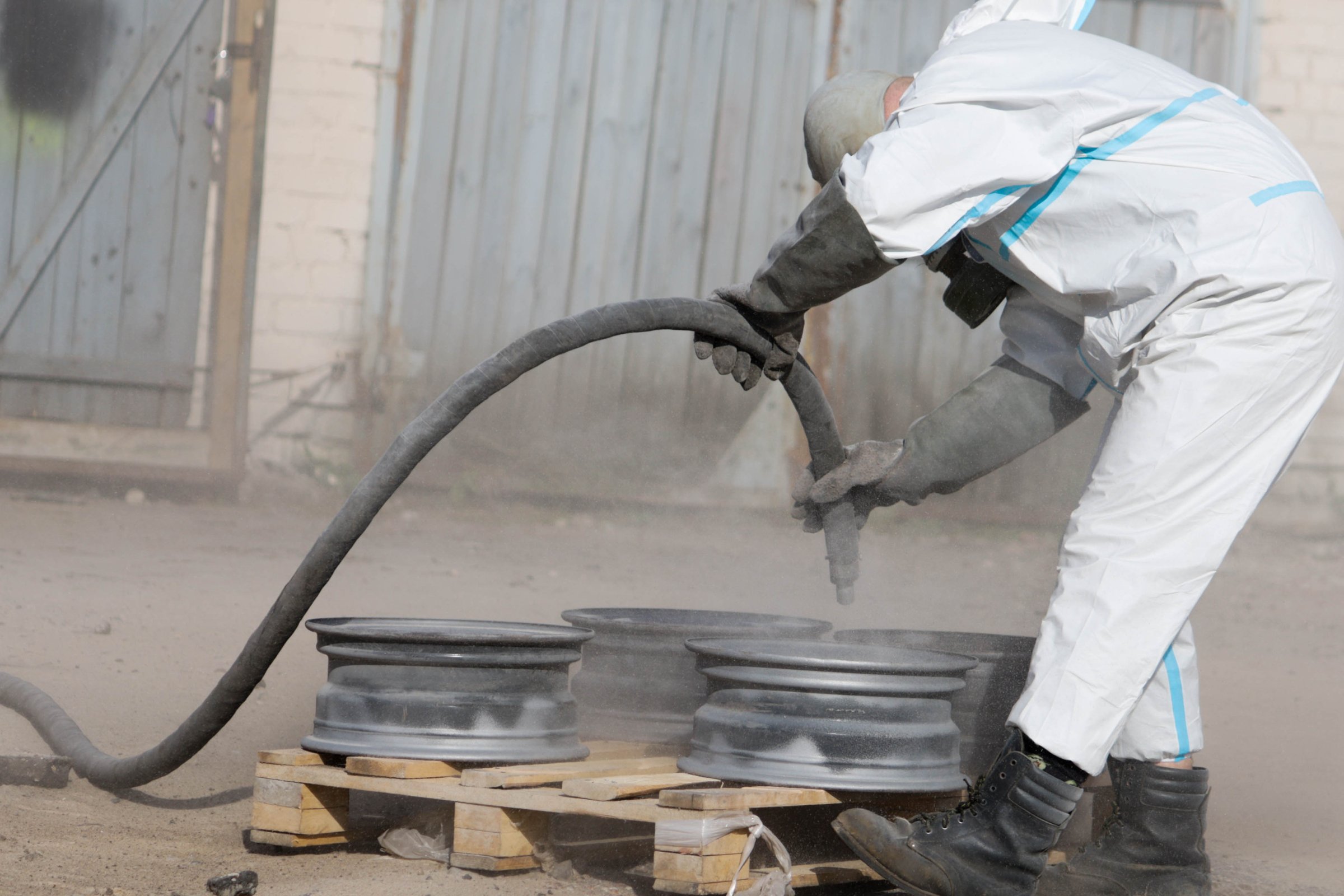 Sandblasting restoration of metal wheel rims, rust removal