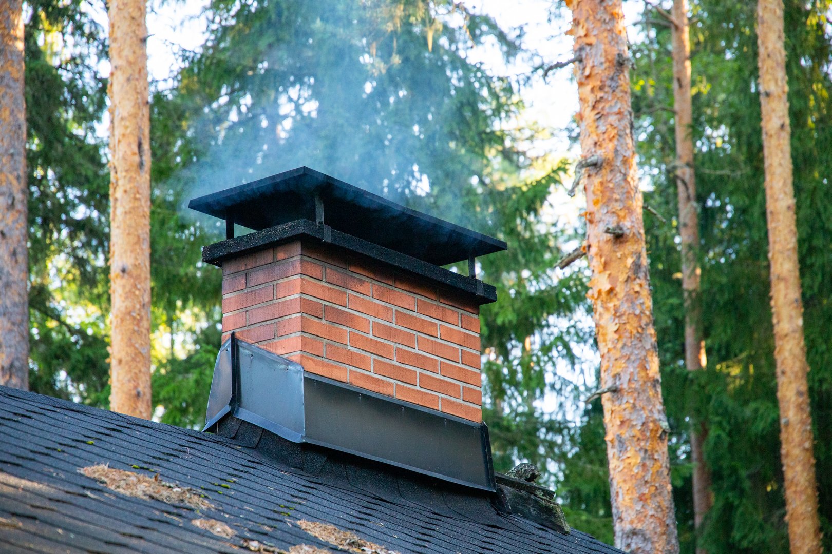 some smoke raising from a chimney