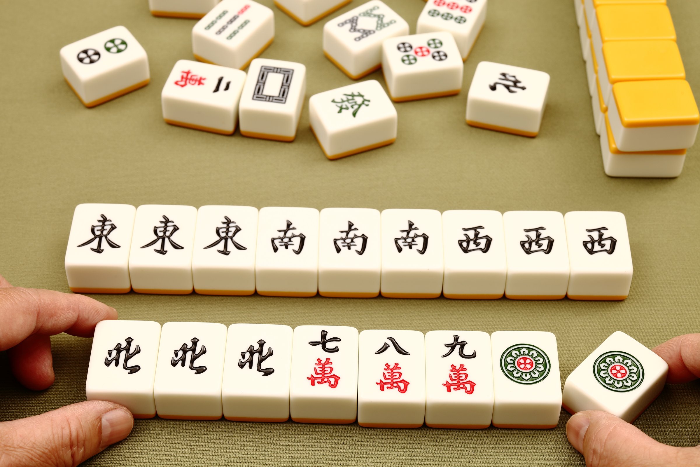 Chinese mahjong tiles, close-up of mahjong tiles on green background