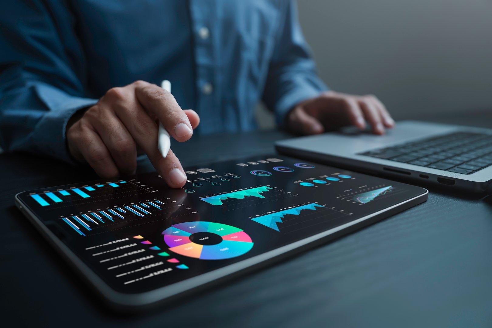 An analyst uses a computer and dashboard for data business analysis and Data Management System with KPI and metrics connected to the database for technology finance, operations, sales, marketing