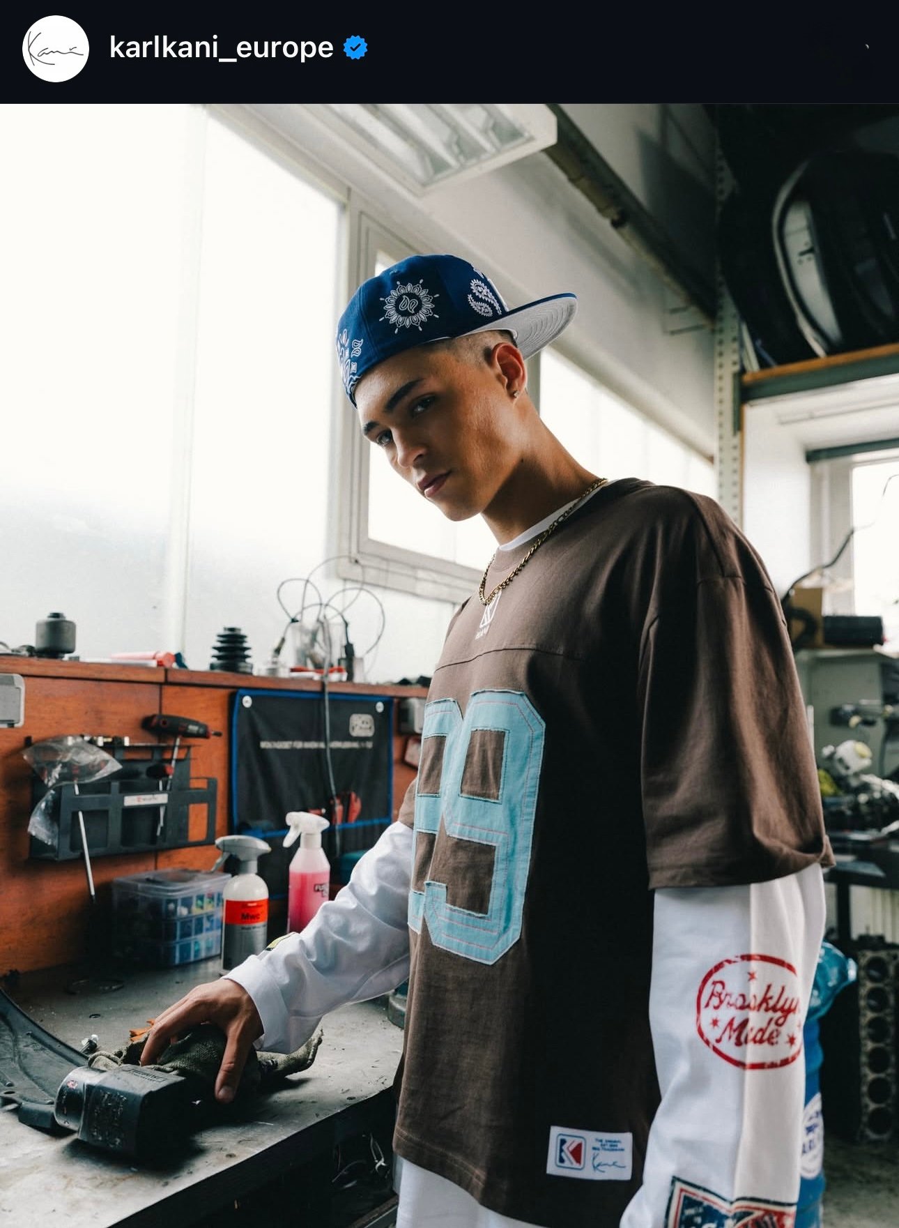 Male model on a Karl Kani Europe fashion shoot wearing streetwear.