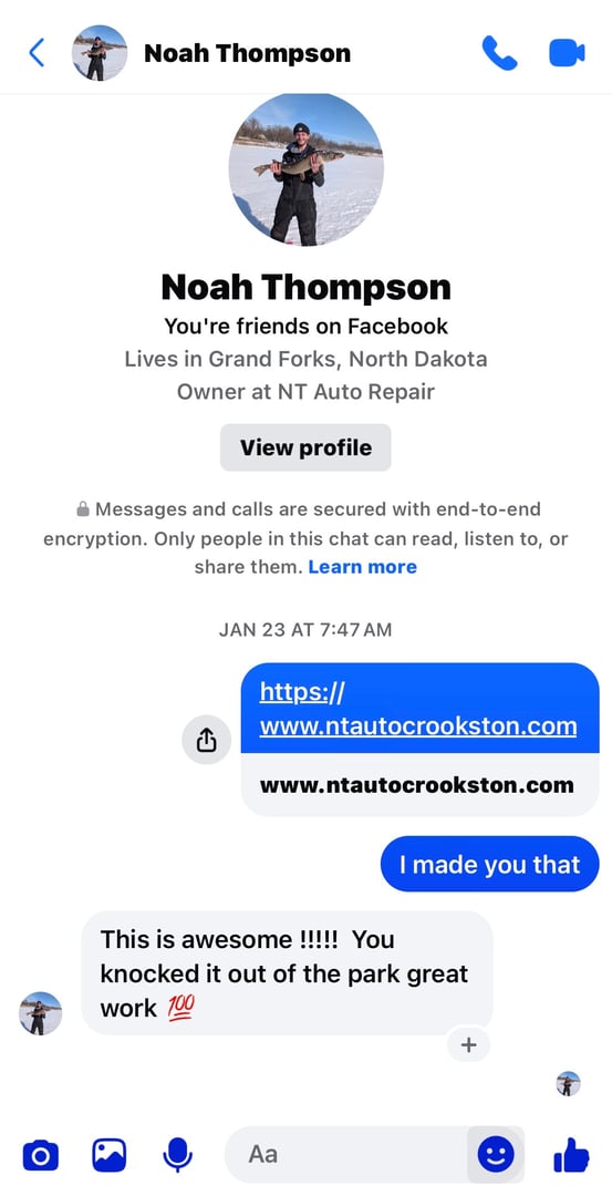 Dillon holding a fish while wearing a fishing vest