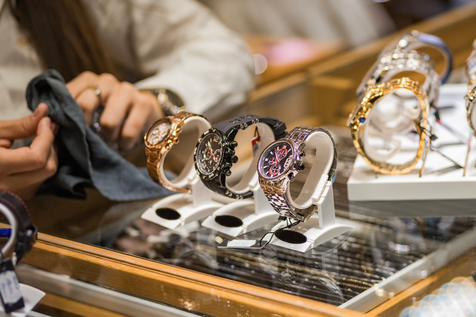 Close-up of elegant wristwatches on display in a jewelry store, showcasing luxury and style. Perfect for fashion enthusiasts and collectors seeking timeless beauty.