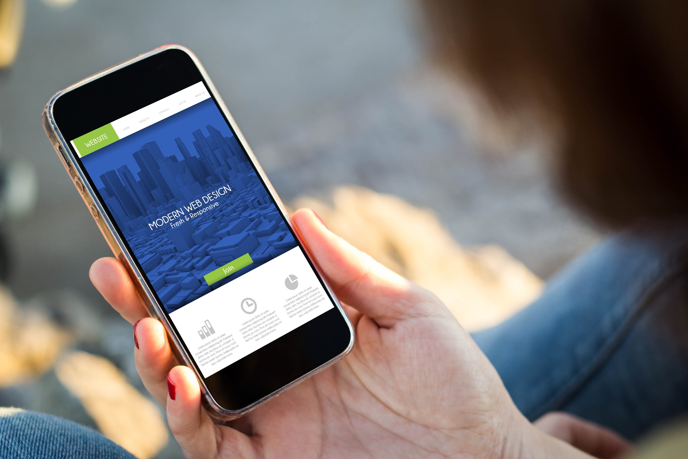 close-up view of young woman checking her mobile phone. All screen graphics are made up.