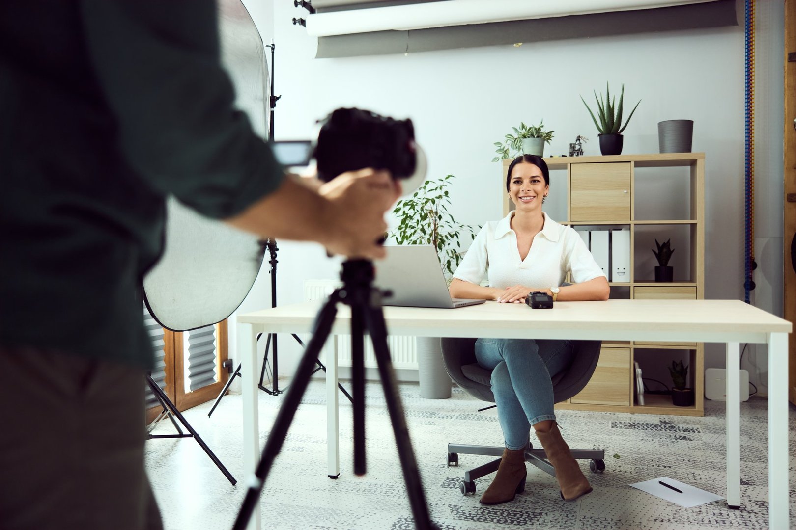 Confident female vlogger recording content for her online blog in a studio office