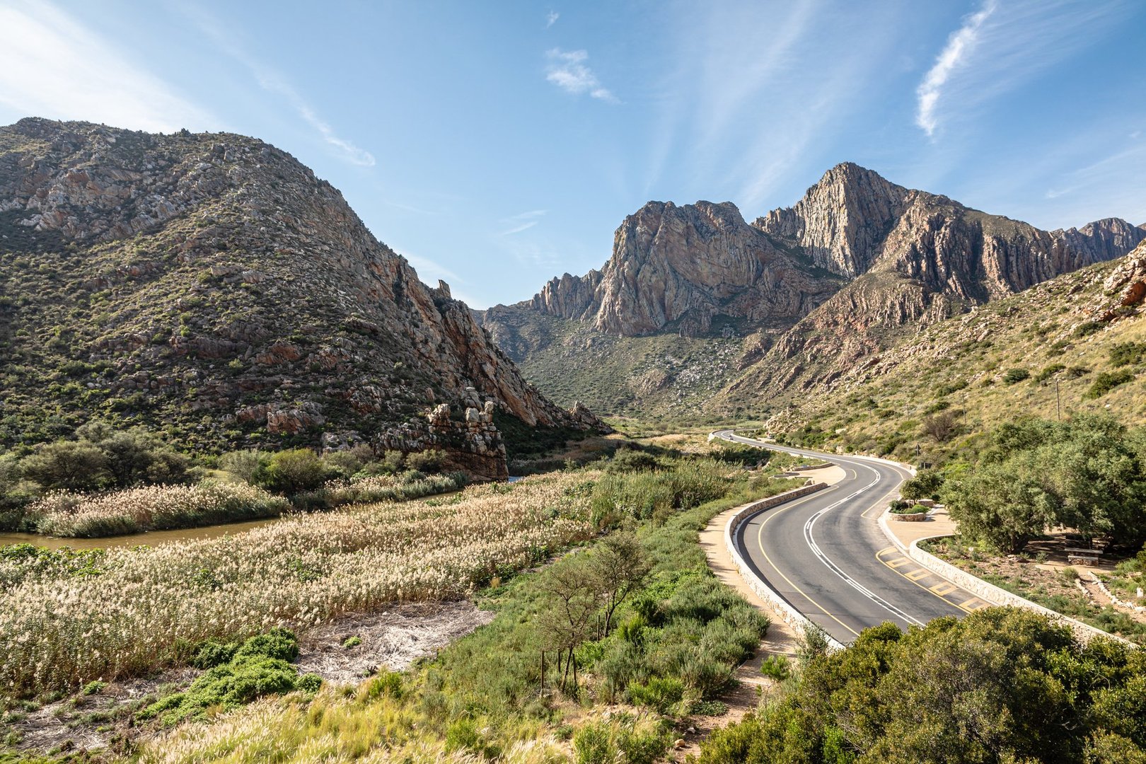 Winding mountain road through majestic mountains