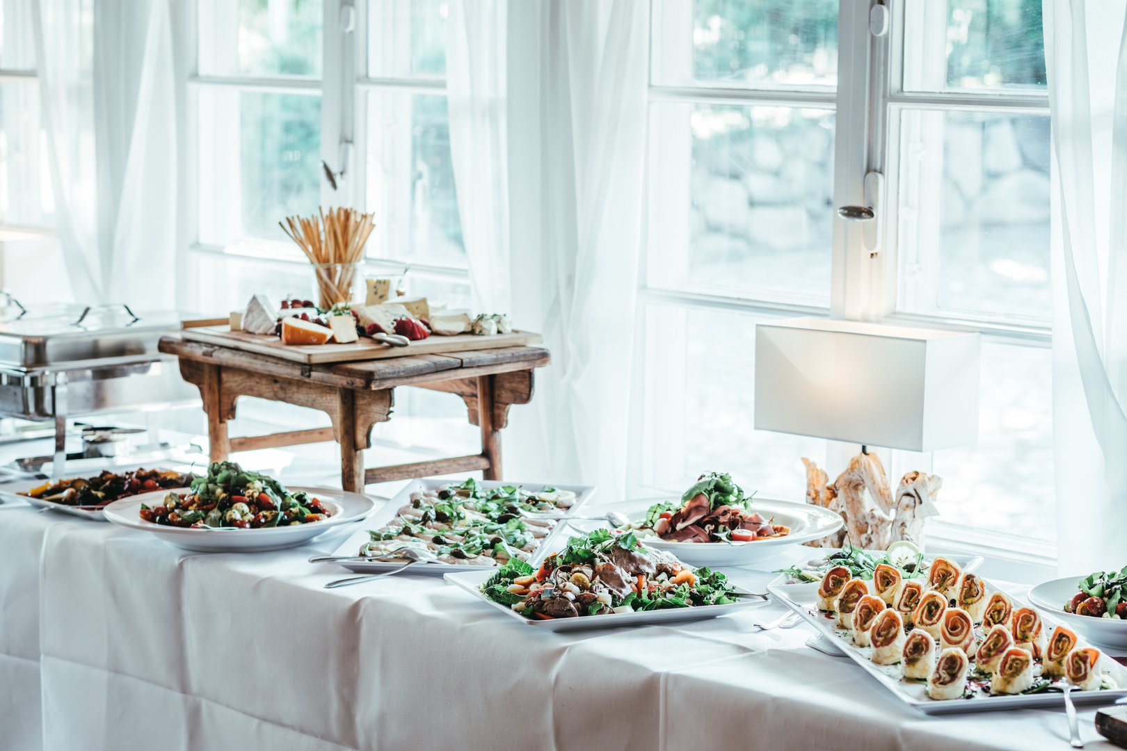 catering a wedding, celebration, party, birthday. Cheese, grapes, breadsticks, salmon rolls, salad, decoration, vegetables, healthy, deliciously fresh