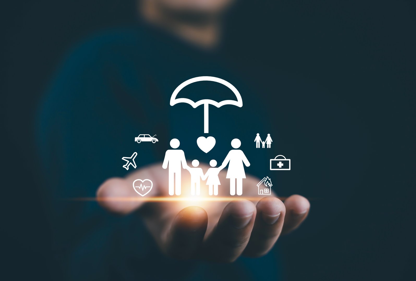 Hand holding family insurance protection icons with umbrella symbol, concept of health insurance, life coverage, financial security, family care, safety plan, risk management, medical service, travel