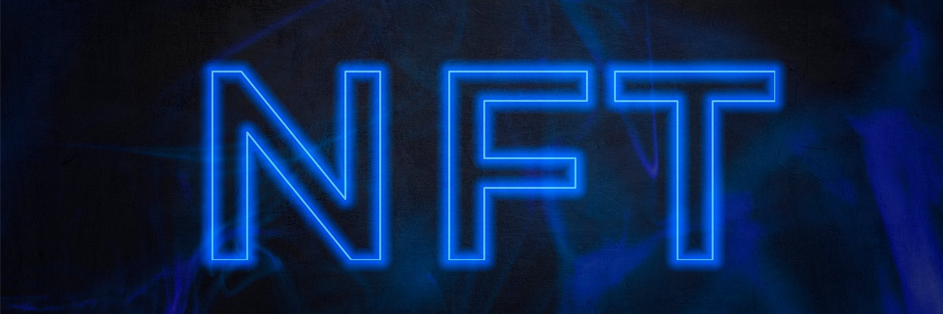 Text design of "NFT" projected on the background. The acronym "NFT" stands for Non-Fungible Token, which refers to a digital asset that cannot be consumed or replaced. NTF concept