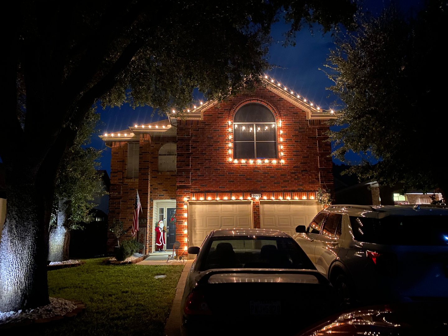 Stunning Christmas tree and holiday lighting display by J&S Custom Lighting