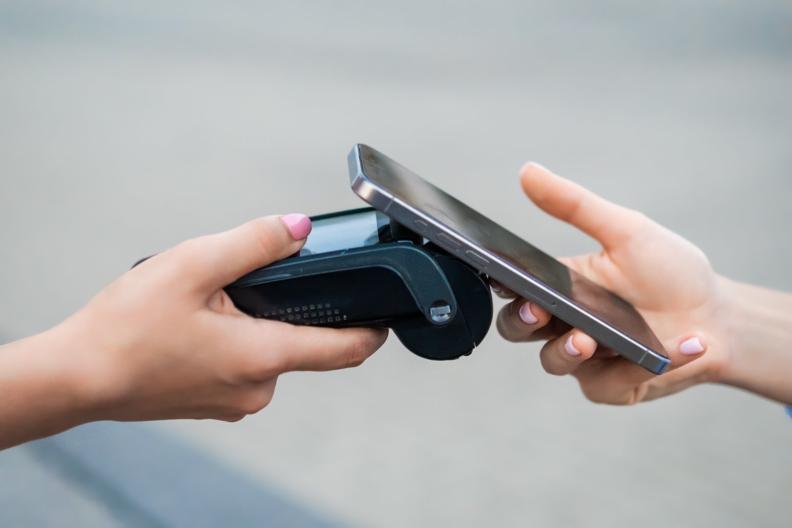 Contactless payment processing at a retail store using a terminal and smartphone.