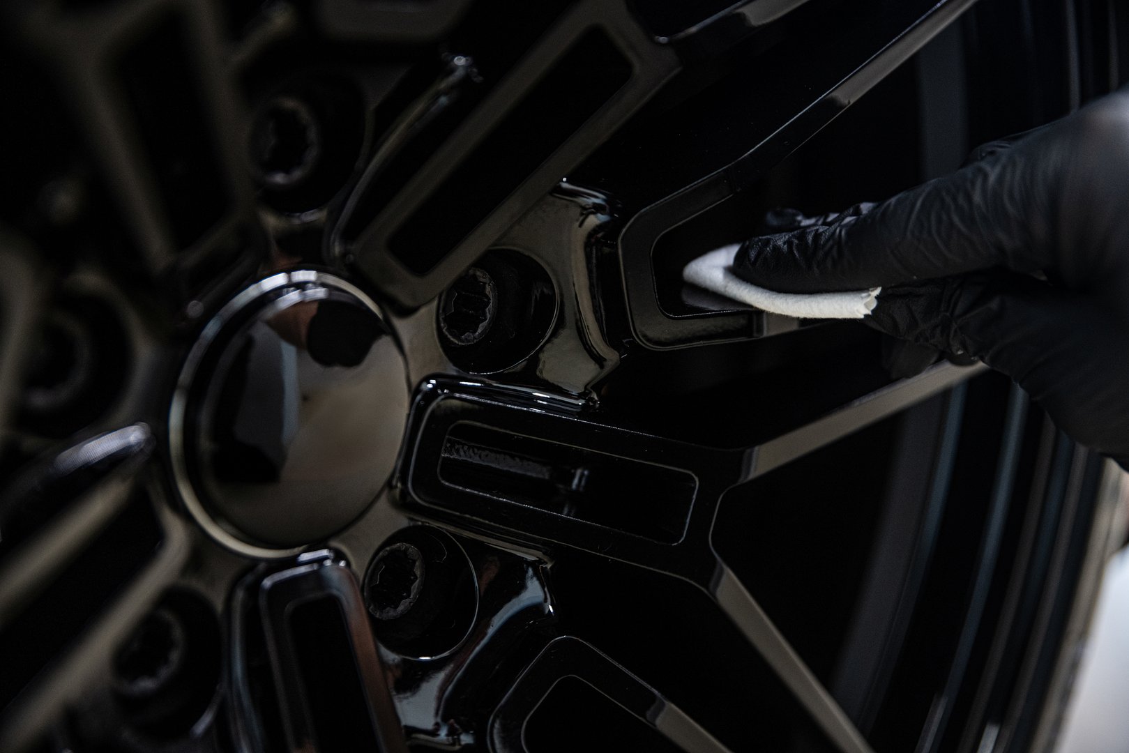 Ceramic protective coating applied on the car rim ensures a high-gloss finish and long-lasting durability for premium wheel care