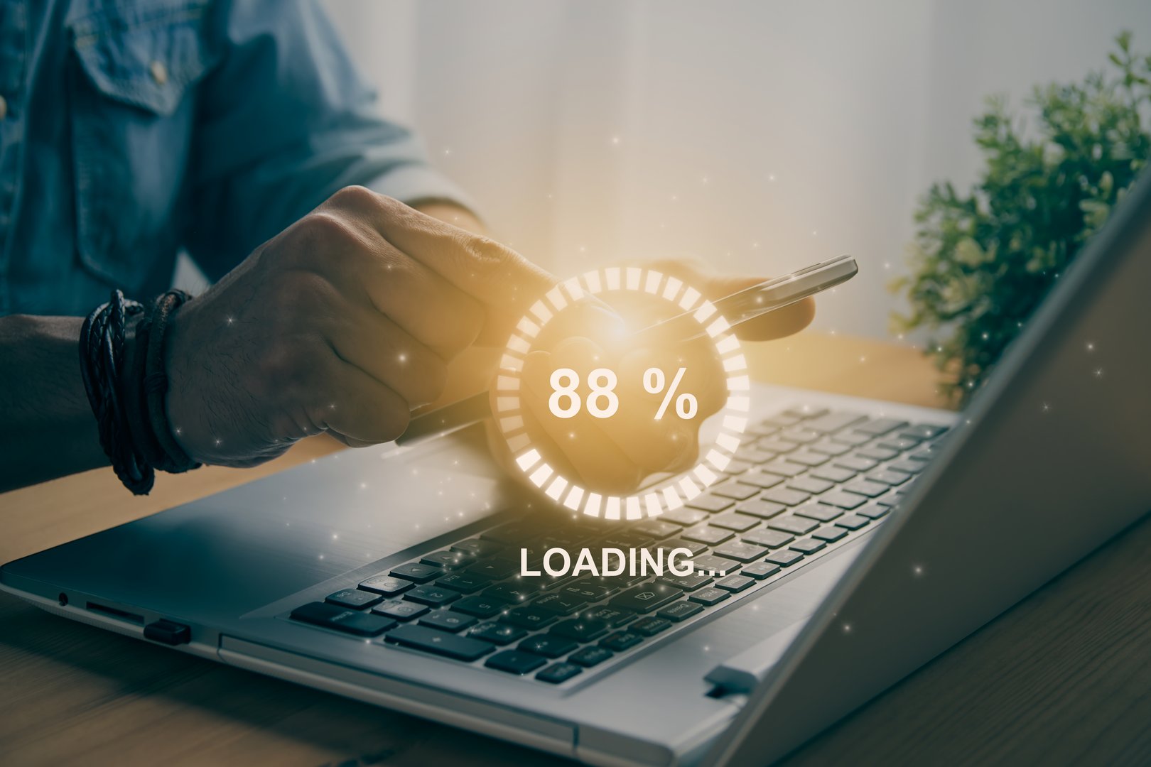 Casual Businessman Touching Mobile Phone or Smart Phone and Circle Loading Module and Laptop Computer. Searching or Downloading Concept in Vintage Tone