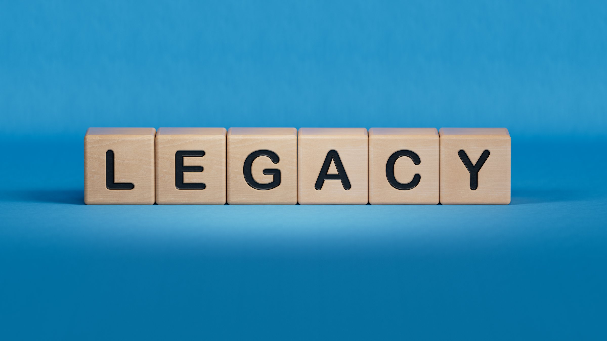 legacy word concept. wooden cubes.close up of wooden elements,Business Concept.3D rendering on blue background.
