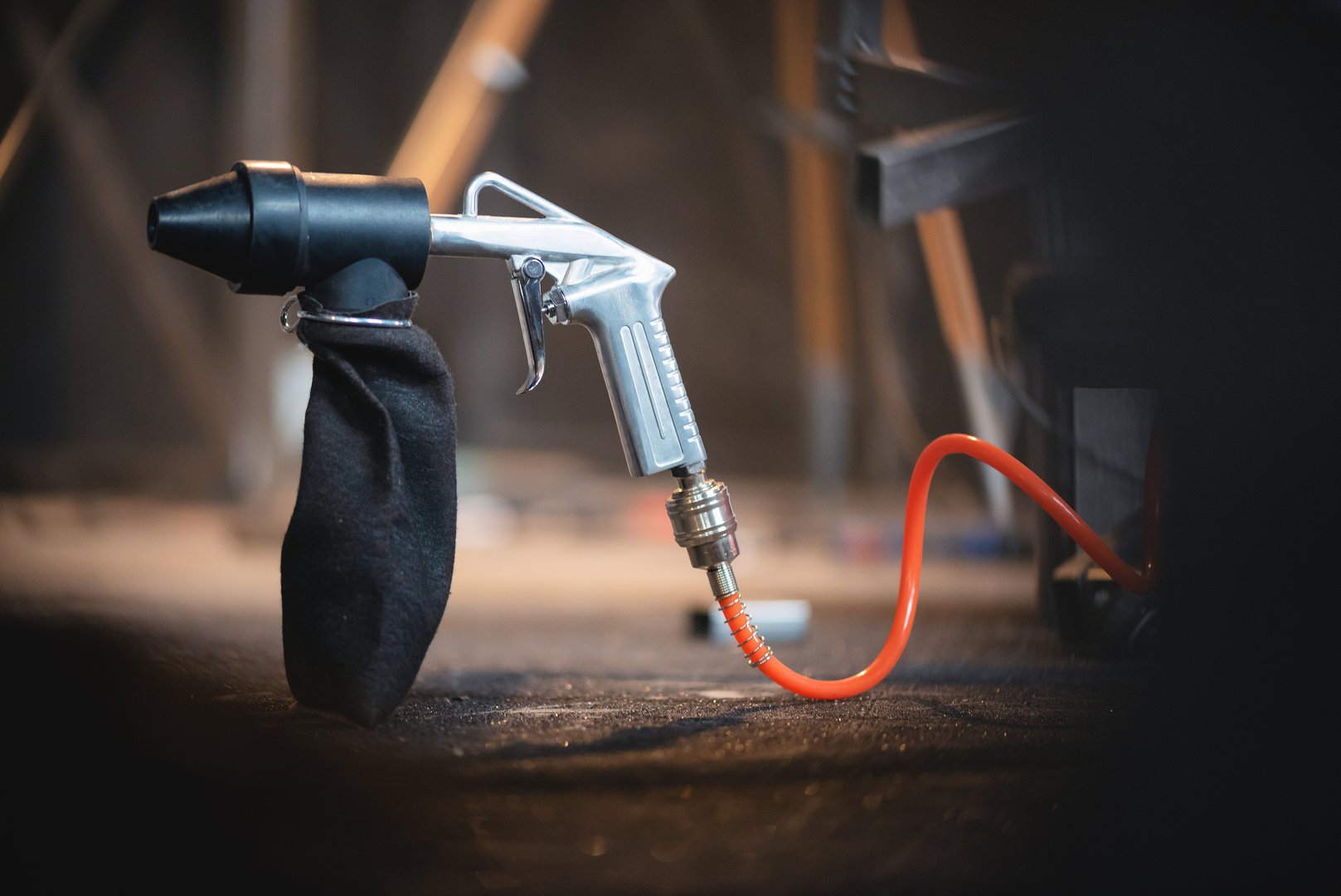 Sandblasting gun close up background.