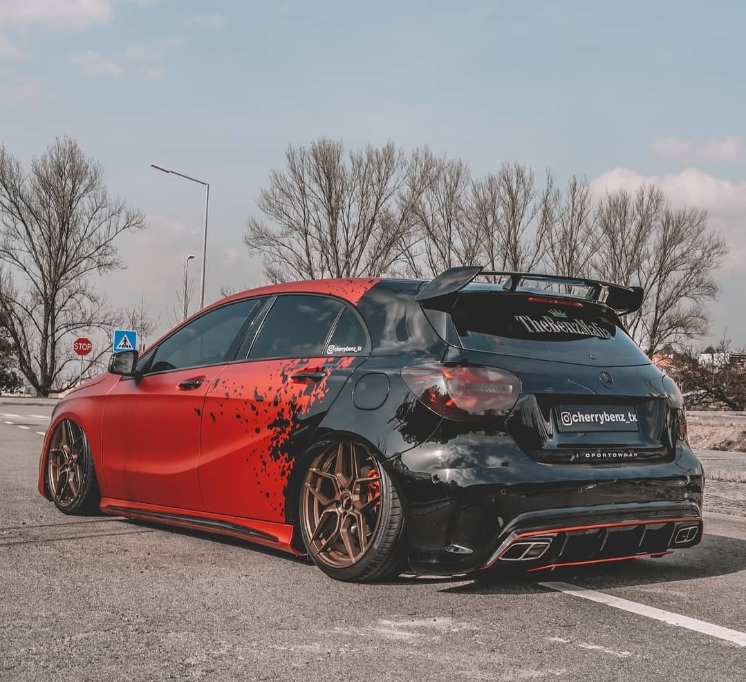 Novosibirsk, Russia - 08.01.2018: Auto bumper part from tuning package Renegade on the floor before painting and installation body kit on Infiniti FX37 in car repair workshop. Auto service industry.