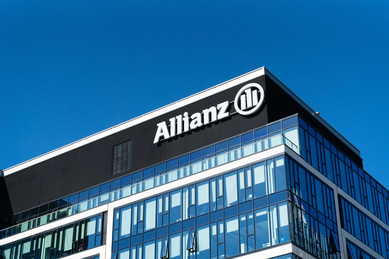 Warsaw, Poland, September 21, 2023 Allianz signage, logo on Allianz Insurance Warsaw building facade, blue sky background, Allianz SE business office, editorial image