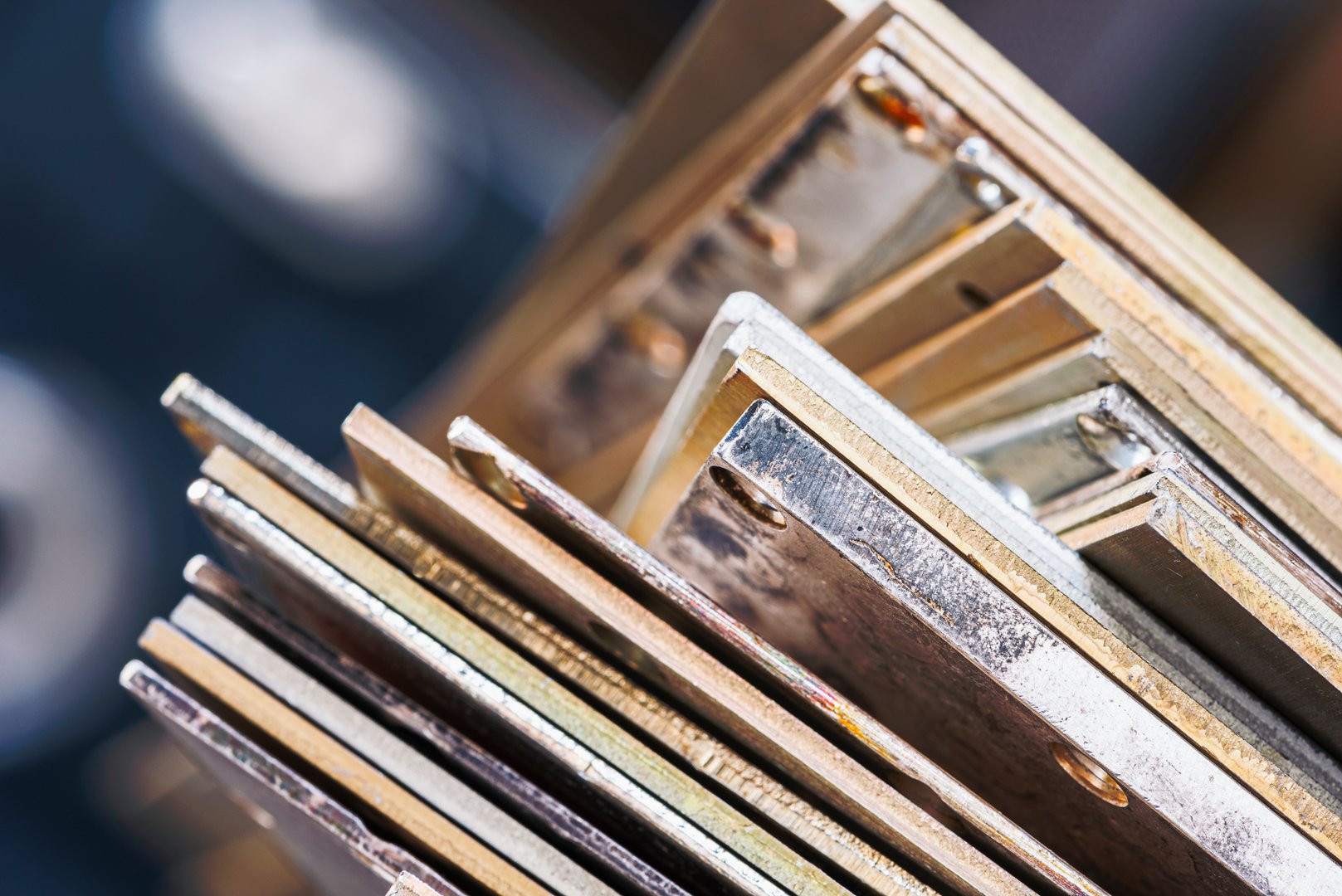Close-up of a stack of nonferrous metal plates in an industrial factory, ready for recycling and reprocessing in manufacturing