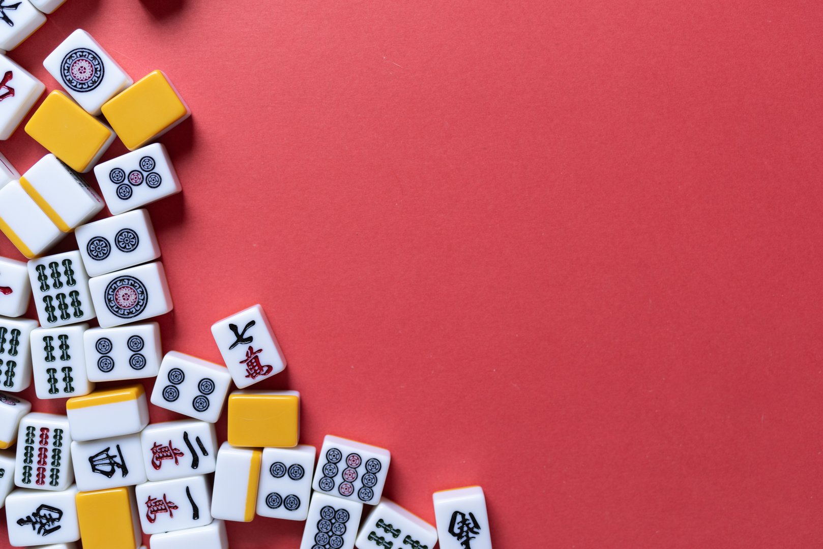 Mahjong tiles background on red background