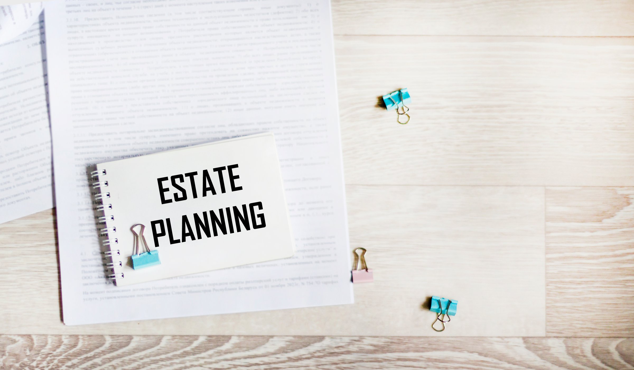 The words about the layout of the property are written on a notebook on a document.