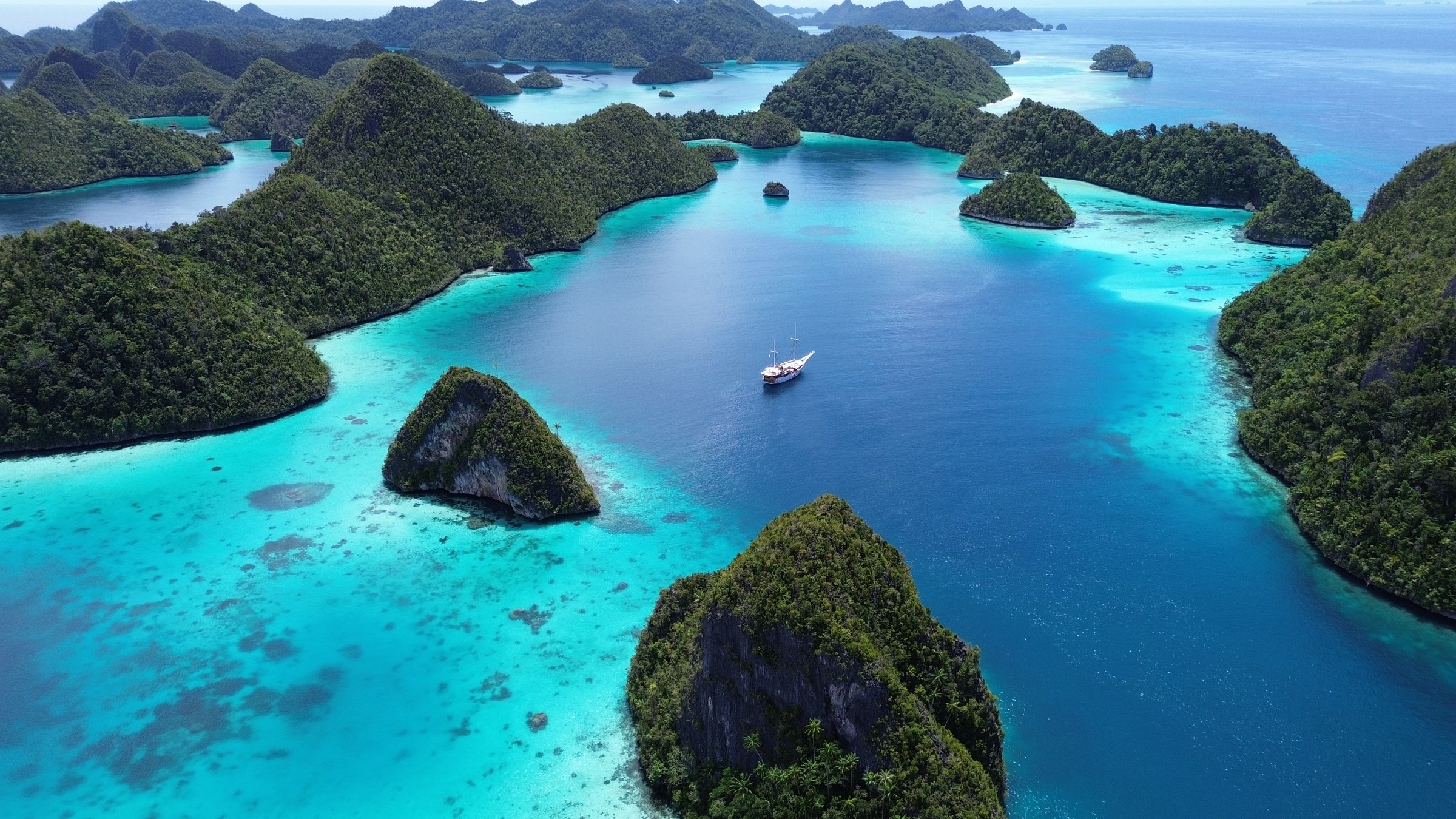 Remote lagoon at Wayag island consisting of limestone islands, Raja Ampat, West Papua, Indonesia, part of the Raja Ampat Marine Protected Area