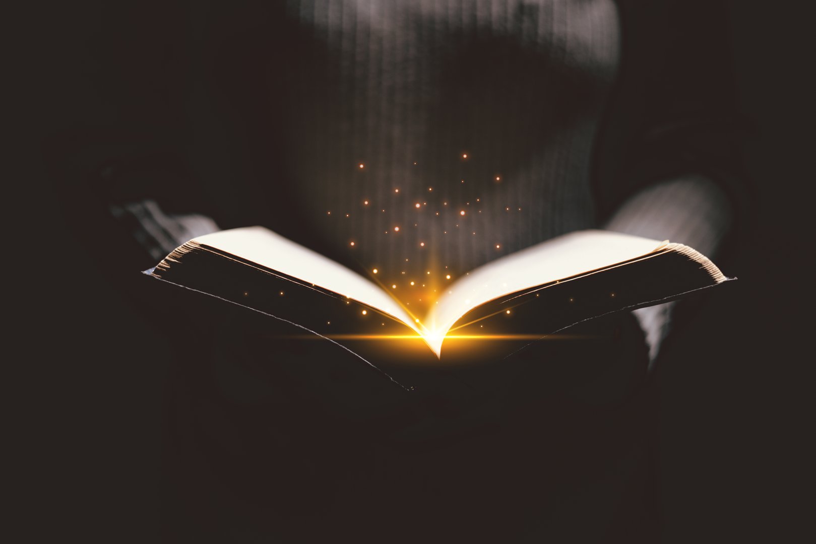Open Bible glowing with golden light, symbolizing the Word of God, faith, prayer, hope, spiritual guidance