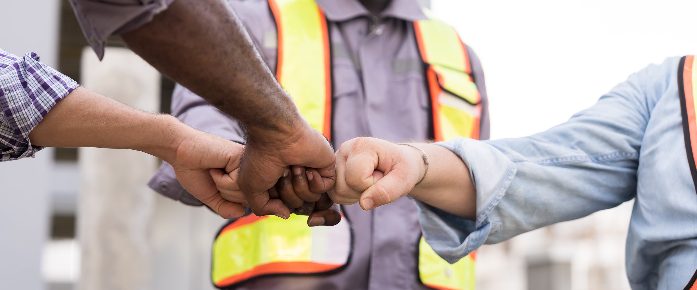 Construction engineers cooperating at job site