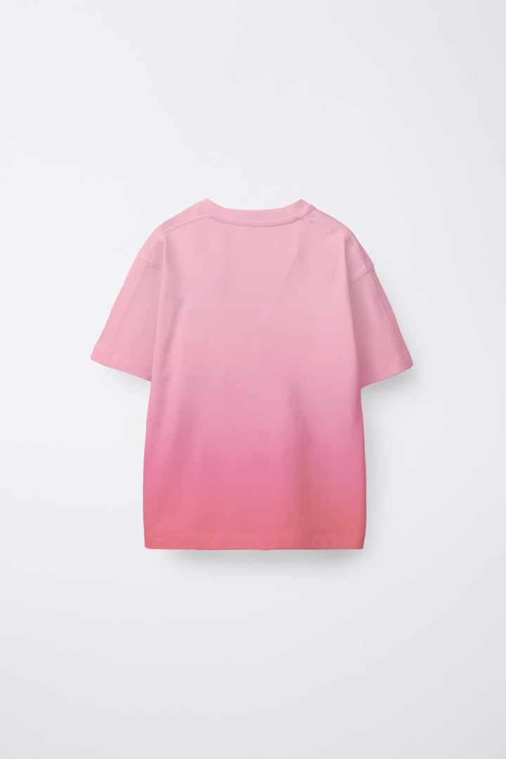 Back view of a pink gradient T-shirt against a plain white background.