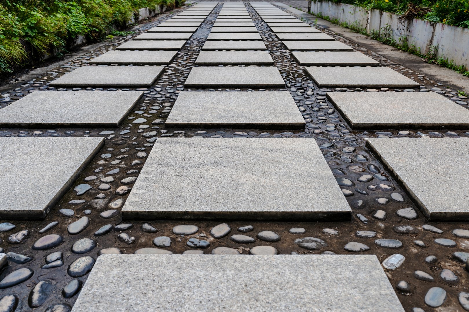 Brick and cobblestone path in the garden, suitable for architecture and industrial themes
