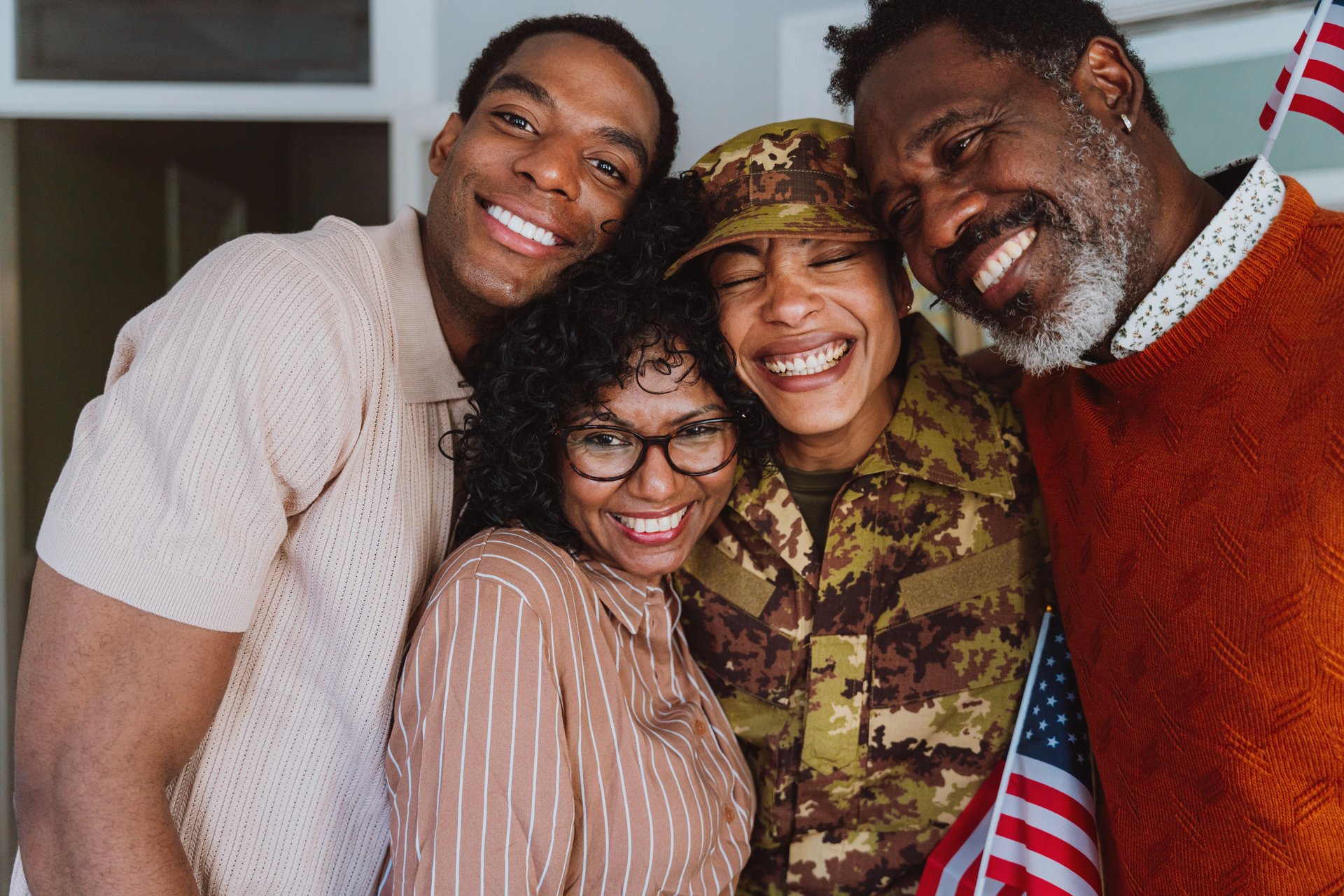 Us Veteran woman homecoming. Young woman coming back to her family from military service for holidays. Female soldier going back home to spend time with relatives.