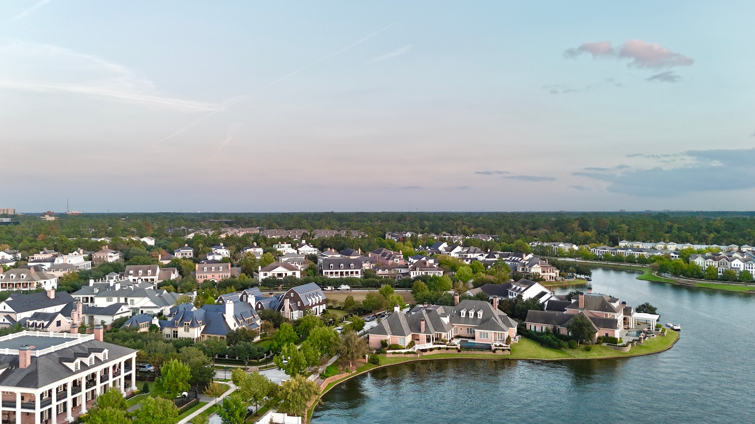 Large mansion houses with swimming pool, in affluent neighborhood metroplex, expensive suburban homes surrounding by lush green trees, aerial view, Texas, USA