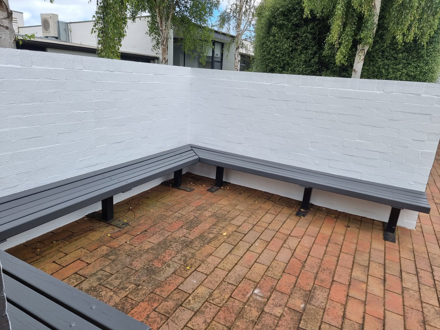 Quality Painting Group office building project - completed renovation showing refreshed exterior from December 2022