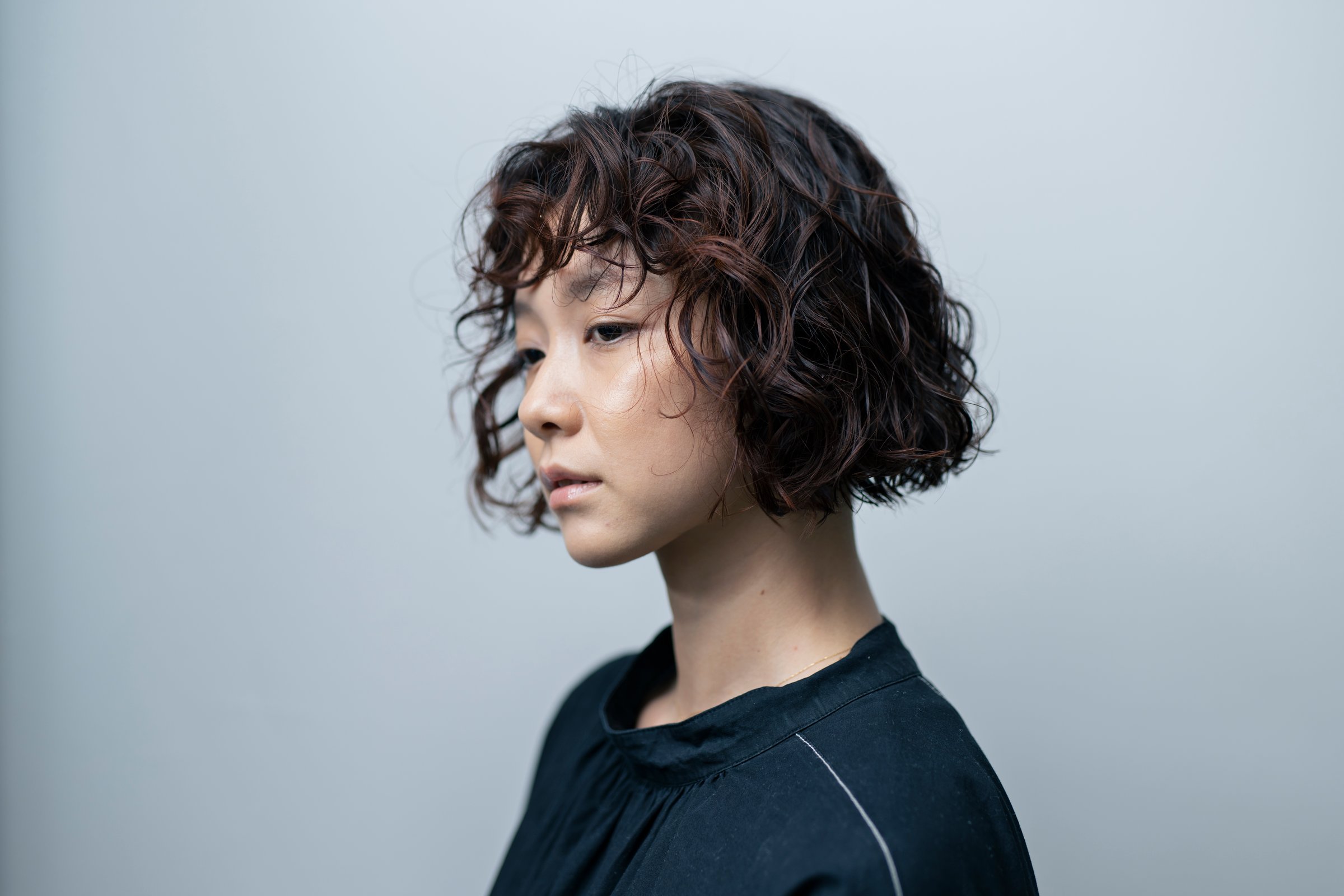 A woman in her 20s with short hair