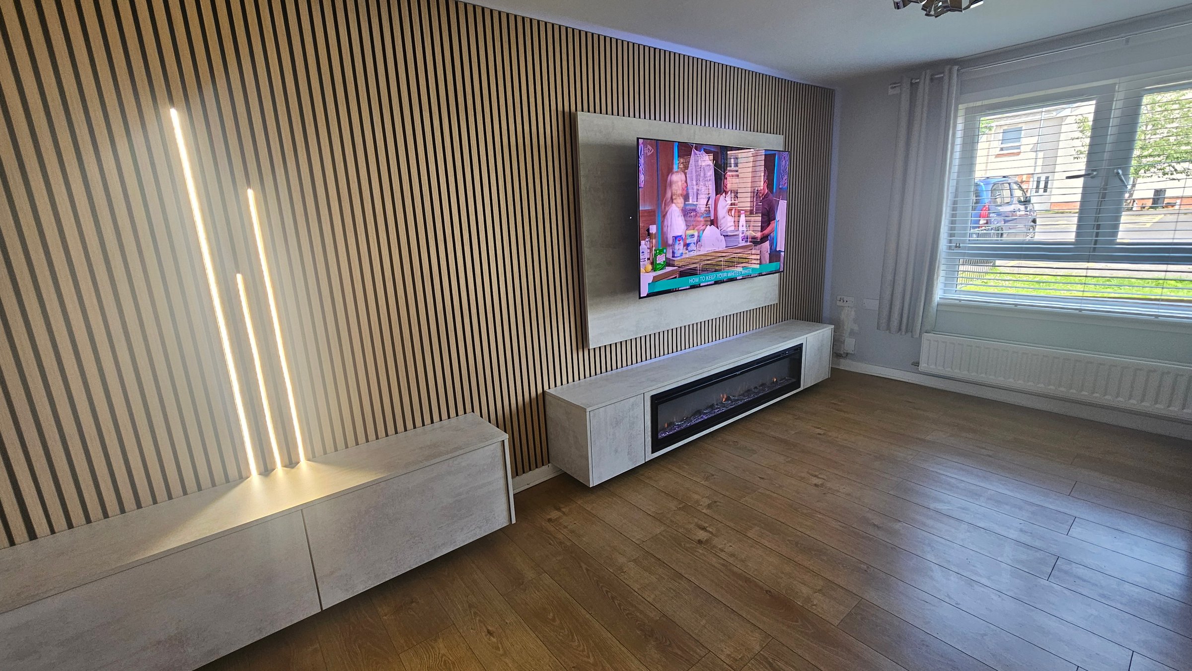 Elegant media wall with floating shelves
