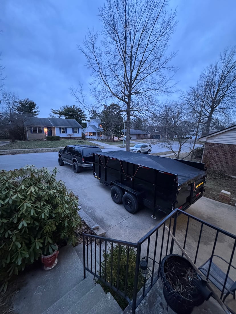 Junk Monkeys junk removal trailer loaded with appliances and debris