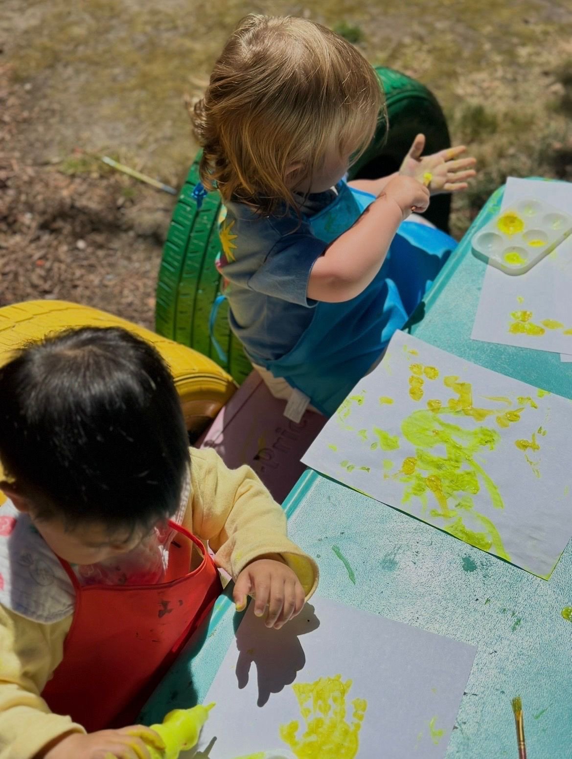 Child playing with building blocks at Rain or Shine Daycare