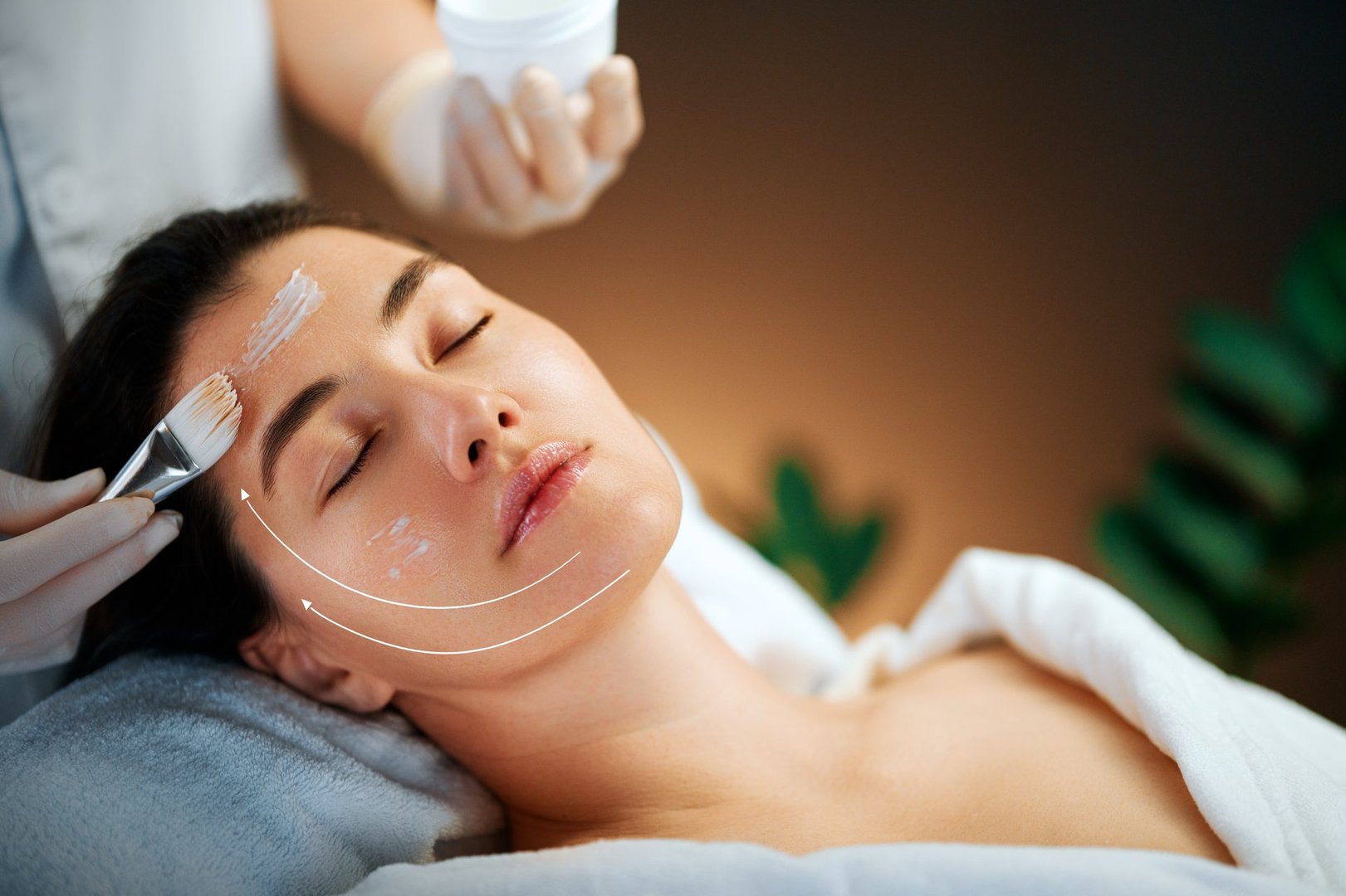 Facial treatment in spa salon. Skin care and massage. Cosmetologist at work