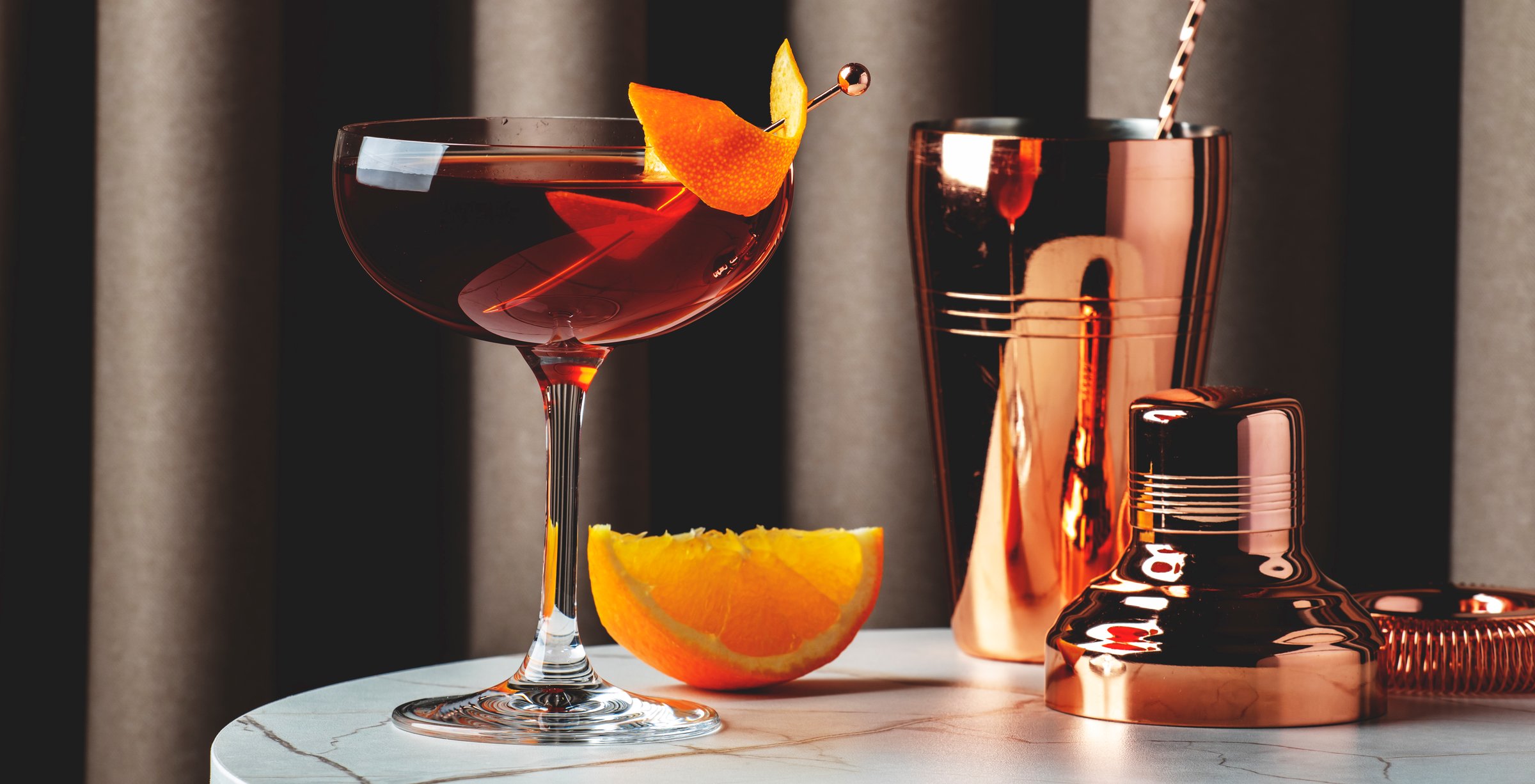 Exquisite bourbon cocktail with orange garnish